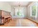 Classic dining room with hardwood floors, chandelier, and large windows at 330 S Ellis St, Salisbury, NC 28144