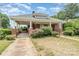 Inviting brick home featuring a covered parking area and traditional architectural details at 330 S Ellis St, Salisbury, NC 28144