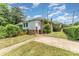 View of the side of the house, showing the yard and architectural details at 330 S Ellis St, Salisbury, NC 28144