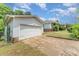 Detached white garage with ample space and a view of the main house at 330 S Ellis St, Salisbury, NC 28144