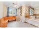 Cozy kitchen featuring unique design with vintage wallpaper and wooden bench at 330 S Ellis St, Salisbury, NC 28144