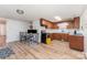 Open floor plan featuring kitchen and dining area with wood cabinets and laminate floors at 330 S Ellis St, Salisbury, NC 28144