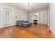 Bright living room with hardwood floors, fireplace, and a comfortable sofa at 330 S Ellis St, Salisbury, NC 28144