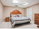 Bedroom with striped bedding, wood furnishings, neutral carpet and a ceiling fan for comfort at 3381 Elaine Ave, Lincolnton, NC 28092