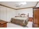 Bedroom with floral bedding, wood furnishings, neutral carpet and a ceiling fan for comfort at 3381 Elaine Ave, Lincolnton, NC 28092