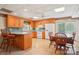Open concept kitchen with island seating and dining area, features oak cabinets at 3381 Elaine Ave, Lincolnton, NC 28092