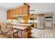Spacious kitchen with oak cabinets, stainless steel appliances and breakfast bar seating at 3381 Elaine Ave, Lincolnton, NC 28092