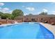 Backyard pool area featuring a diving board, outdoor seating and mature landscaping at 3381 Elaine Ave, Lincolnton, NC 28092