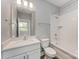 Clean bathroom featuring a shower and bathtub combination with tiled walls and a light vanity sink at 3643 Vallette Ct, Charlotte, NC 28203