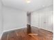 Spacious bedroom with hardwood floors, large closets, and neutral tones, providing a versatile and relaxing retreat at 3643 Vallette Ct, Charlotte, NC 28203