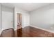 Bedroom with hardwood floors next to an ensuite bathroom and closet space at 3643 Vallette Ct, Charlotte, NC 28203