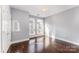 Cozy bedroom with hardwood floors, large windows, and ample natural light, creating a serene and comfortable living space at 3643 Vallette Ct, Charlotte, NC 28203