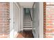 Inviting entryway with hardwood floors, leading to a staircase with a modern railing, offering a glimpse of the upper floors at 3643 Vallette Ct, Charlotte, NC 28203