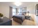 Comfortable bedroom with natural light, blue and gray accents, and stylish furnishings at 4715 Formation Dr # 047, Lancaster, SC 29720