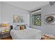 Serene bedroom featuring a comfortable bed, large window, and tasteful artwork at 514 W 10Th St # 302, Charlotte, NC 28202