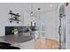 Well-lit kitchen featuring stainless steel appliances, stylish lighting, and bar seating at 514 W 10Th St # 302, Charlotte, NC 28202