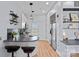 Compact kitchen featuring sleek countertops, stainless steel appliances, and wood floors at 514 W 10Th St # 302, Charlotte, NC 28202