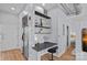 Efficient kitchenette with stainless steel refrigerator and built in workspace at 514 W 10Th St # 302, Charlotte, NC 28202