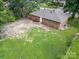 Aerial shot of backyard, showcasing a spacious lawn and the home's brick exterior at 5323 Snow White Ln, Charlotte, NC 28213