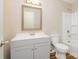 Bathroom featuring vanity, toilet, framed mirror and shower with a tub at 5323 Snow White Ln, Charlotte, NC 28213
