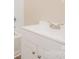 Bright bathroom featuring a white vanity and sink, complemented by a classic shower and tub combination at 5323 Snow White Ln, Charlotte, NC 28213