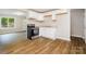 Bright kitchen featuring white cabinetry and a stainless steel range at 5323 Snow White Ln, Charlotte, NC 28213