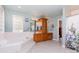 Well-lit bathroom featuring a soaking tub, double vanity, and oak cabinetry at 544 Hicks Creek Rd, Troutman, NC 28166