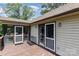 Outdoor deck with white screen doors, offering a relaxing space with natural light and backyard access at 544 Hicks Creek Rd, Troutman, NC 28166