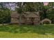 Charming single-Gathering home with a welcoming front porch, mature trees, and a detached garage at 544 Hicks Creek Rd, Troutman, NC 28166