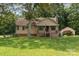 Charming single-Gathering home with a welcoming front porch, mature trees, and a detached garage at 544 Hicks Creek Rd, Troutman, NC 28166