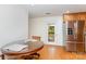 Cozy kitchen with stainless steel refrigerator, wood cabinets and a door to the outside at 544 Hicks Creek Rd, Troutman, NC 28166
