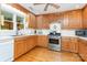 Kitchen with oak cabinets, stainless steel appliances, and white countertops at 544 Hicks Creek Rd, Troutman, NC 28166