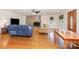 Bright living room featuring a stone fireplace, hardwood floors, and comfortable seating area at 544 Hicks Creek Rd, Troutman, NC 28166