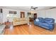 Bright living room featuring hardwood floors, comfortable seating, and an abundance of natural light at 544 Hicks Creek Rd, Troutman, NC 28166