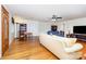 Bright living room featuring hardwood floors, a cozy seating area, and a bookshelf with a desk at 544 Hicks Creek Rd, Troutman, NC 28166