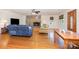 Bright living room featuring a stone fireplace, hardwood floors, and comfortable seating area at 544 Hicks Creek Rd, Troutman, NC 28166