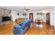 Bright living room with hardwood floors, stone fireplace, comfortable seating, and natural light at 544 Hicks Creek Rd, Troutman, NC 28166