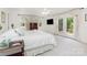 Well lit main bedroom with access to a deck with exterior views at 544 Hicks Creek Rd, Troutman, NC 28166