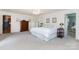 Spacious main bedroom with a large dresser and ensuite bathroom at 544 Hicks Creek Rd, Troutman, NC 28166