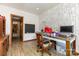 Office with built-in storage, a dark-stained desk, and chair at 544 Hicks Creek Rd, Troutman, NC 28166