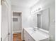 Bright bath with shower featuring white subway tile and new vanity at 6513 Old Post Rd, Charlotte, NC 28212
