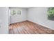 Well lit bedroom with two windows and hardwood flooring at 6513 Old Post Rd, Charlotte, NC 28212