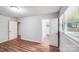 Bedroom with hardwood flooring and view of entry to bath and closet at 6513 Old Post Rd, Charlotte, NC 28212