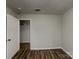 A comfortable bedroom with wood floors and a neutral color scheme, creating a cozy and inviting atmosphere at 6513 Old Post Rd, Charlotte, NC 28212