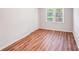 Bedroom features wood-look floors, neutral walls, window and large closet at 6513 Old Post Rd, Charlotte, NC 28212