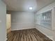 A well-lit dining room with wood floors and large windows, perfect for Gathering meals and entertaining guests at 6513 Old Post Rd, Charlotte, NC 28212