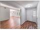 Inviting foyer with hardwood floors leading into a bright living area at 6513 Old Post Rd, Charlotte, NC 28212