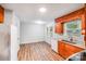 Kitchen featuring wood cabinets, granite countertops, and modern appliances at 6513 Old Post Rd, Charlotte, NC 28212