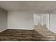 Spacious living room featuring wood flooring, neutral walls, and ample space for comfortable furniture arrangement at 6513 Old Post Rd, Charlotte, NC 28212