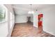 Spacious living room with wood floors, neutral paint, and open floor plan at 6513 Old Post Rd, Charlotte, NC 28212